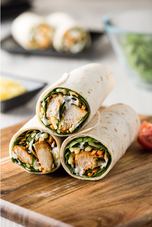 Piadina with breaded chicken, tzatziki sauce and spinach